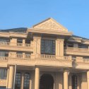 新乡黄金麻别墅外墙干挂石材效果示例