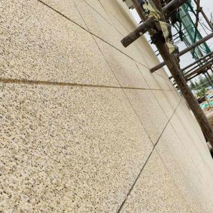 新乡 黄金麻花岗岩荔枝面外墙干挂石材效果示例